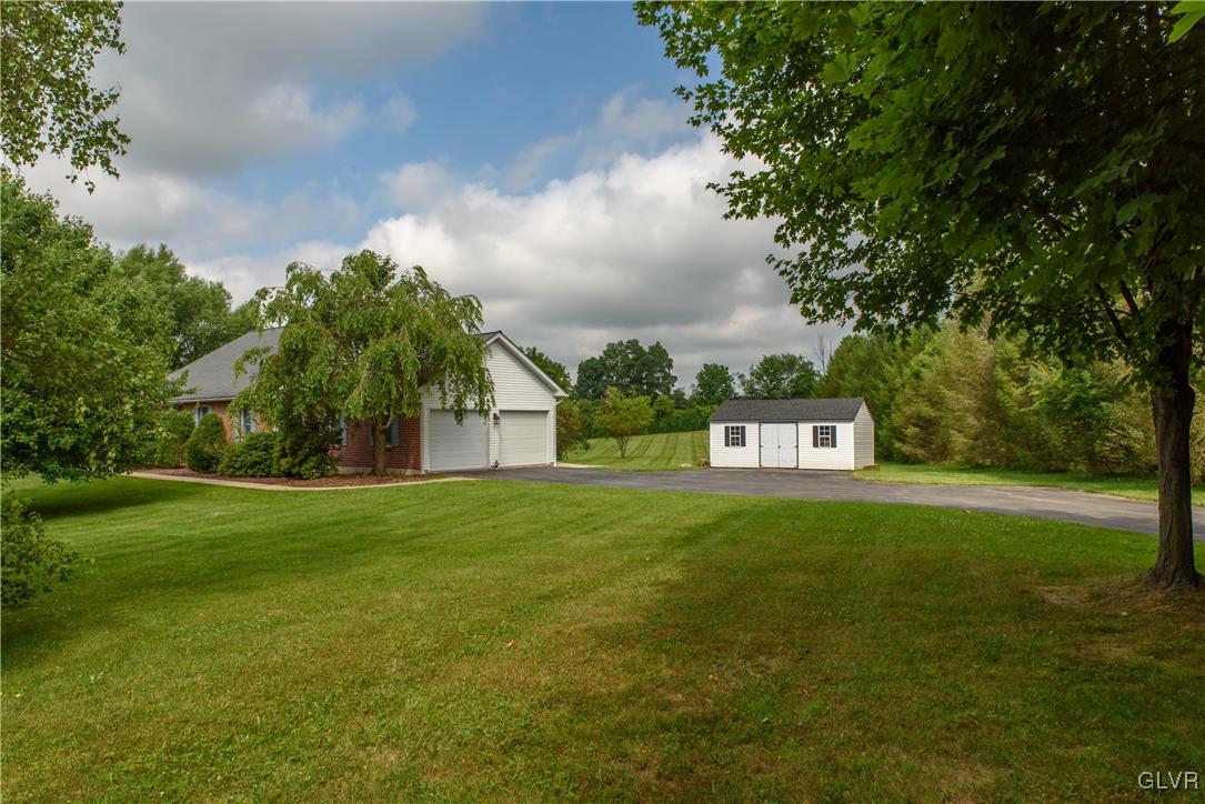 1213 Seifert Road Nazareth, PA 18064 - Photo 20 of 25 a house view with garden space and trees