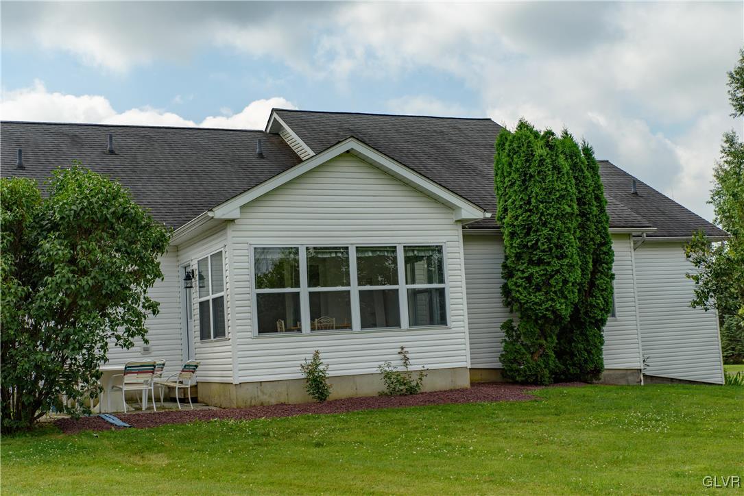1213 Seifert Road Nazareth, PA 18064 - Photo 23 of 25 a large house with a big yard and large trees
