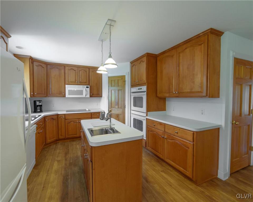 1213 Seifert Road Nazareth, PA 18064 - Photo 9 of 25 a kitchen that has a sink stainless steel appliances a counter space and cabinets