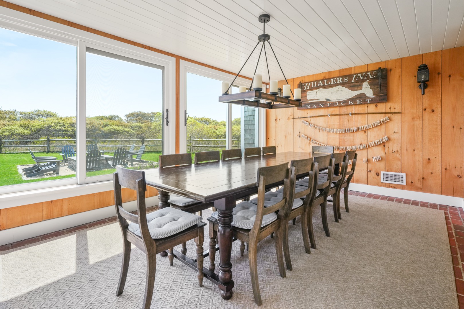 21 Quidnet Road Nantucket, MA 02554 - Photo 10 of 62 a view of a dining room with furniture window and outside view