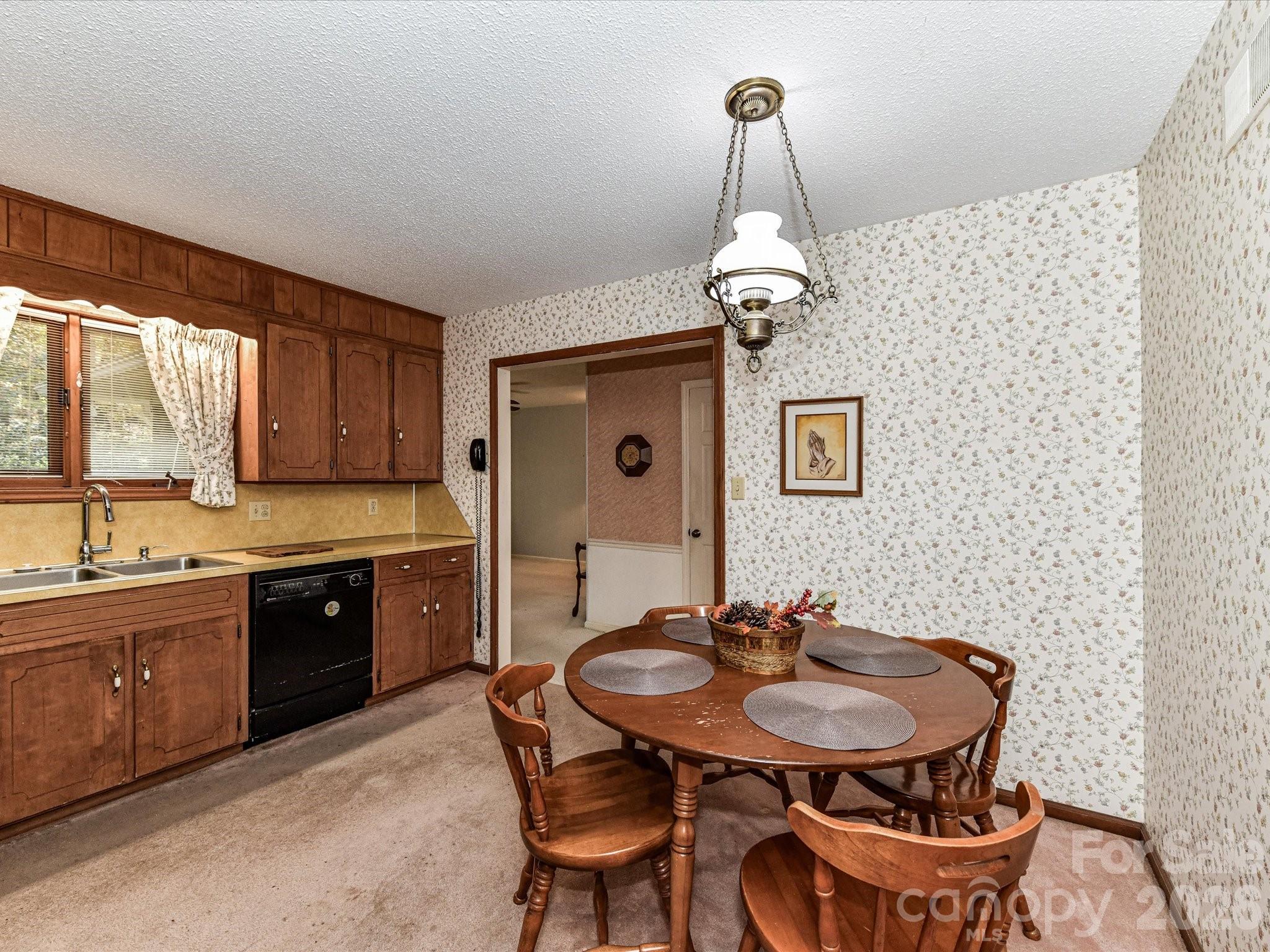 127 Todd Circle Wingate, NC 28174 - Photo 12 of 36 a kitchen with a sink and stove