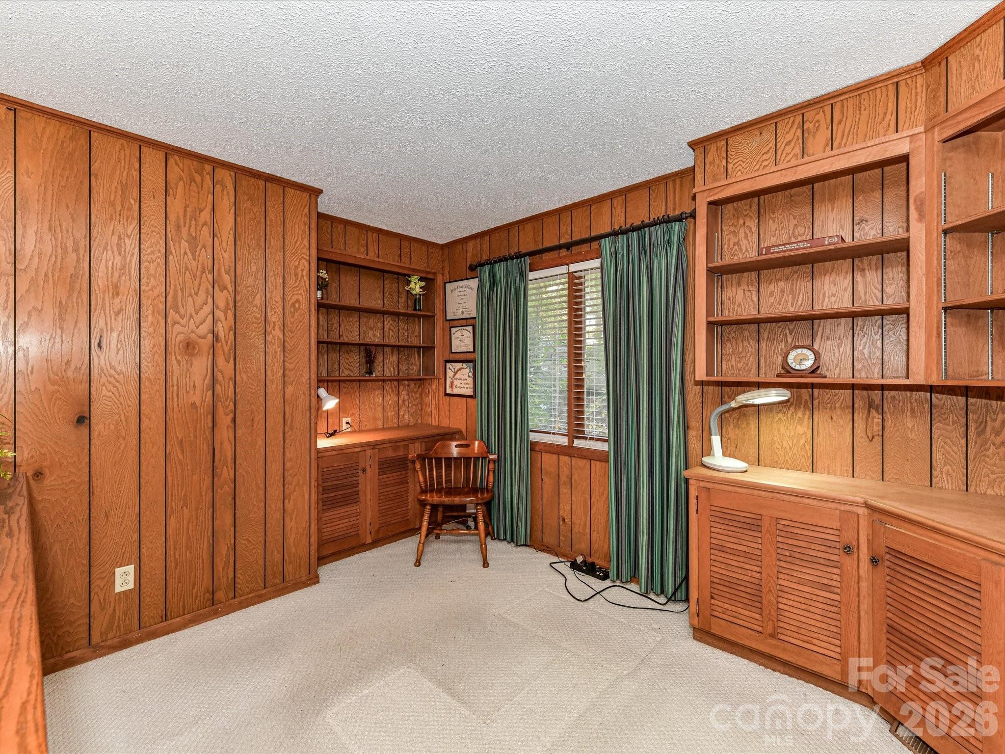 127 Todd Circle Wingate, NC 28174 - Photo 17 of 36 a view of a bedroom with furniture and wooden closet