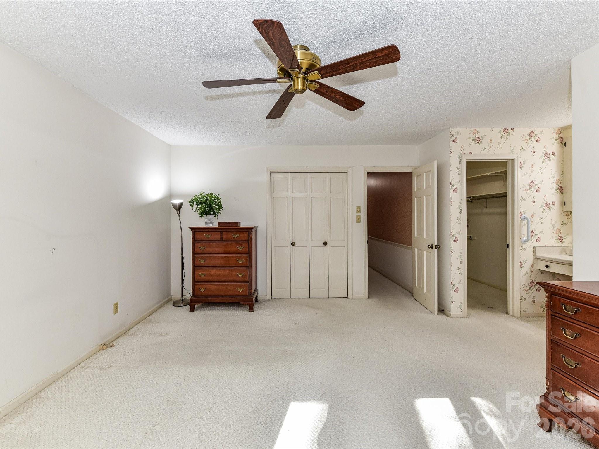 127 Todd Circle Wingate, NC 28174 - Photo 20 of 36 a view of empty room with wooden floor and ceiling fan