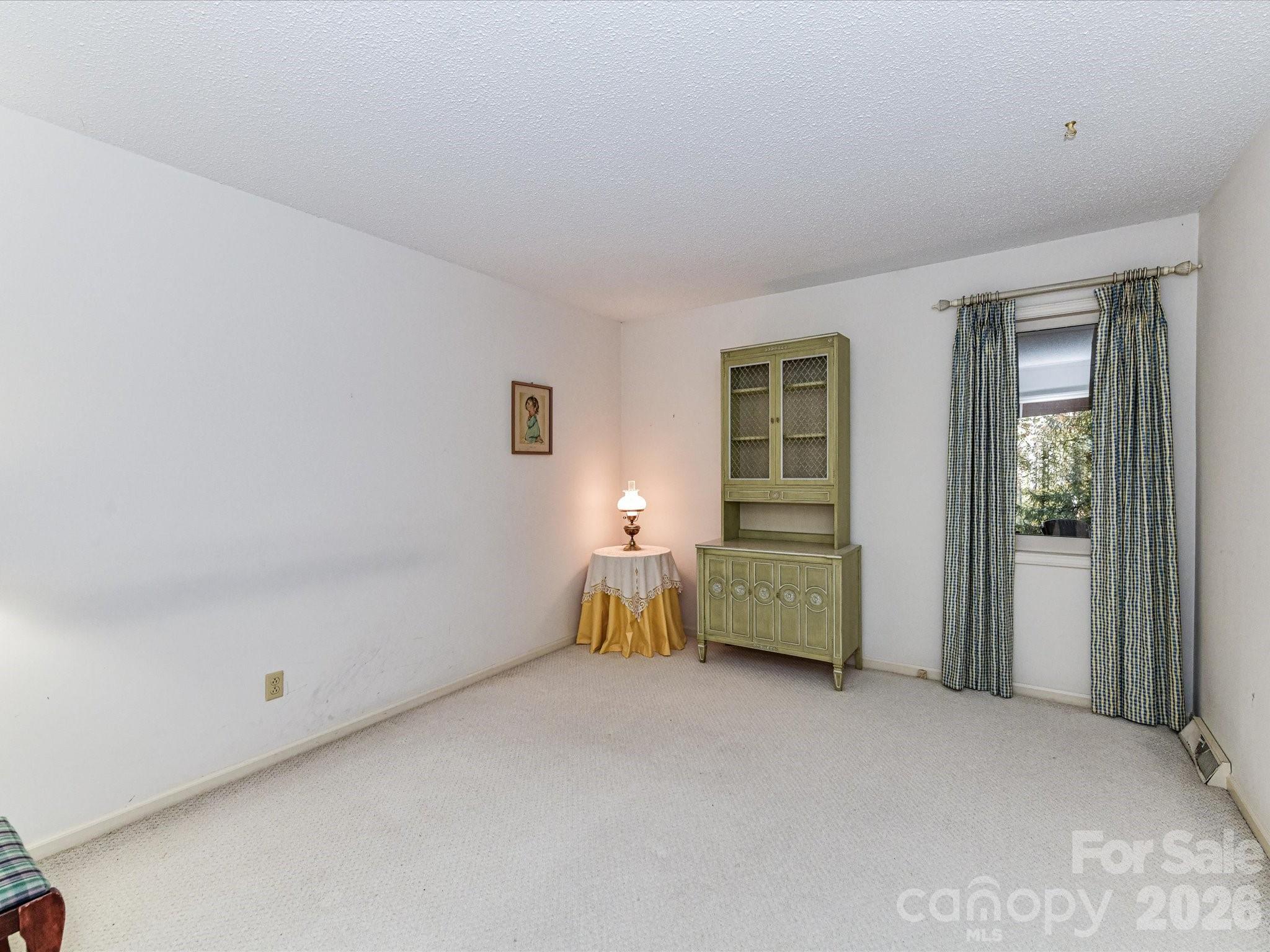 127 Todd Circle Wingate, NC 28174 - Photo 25 of 36 a room with bed and a window