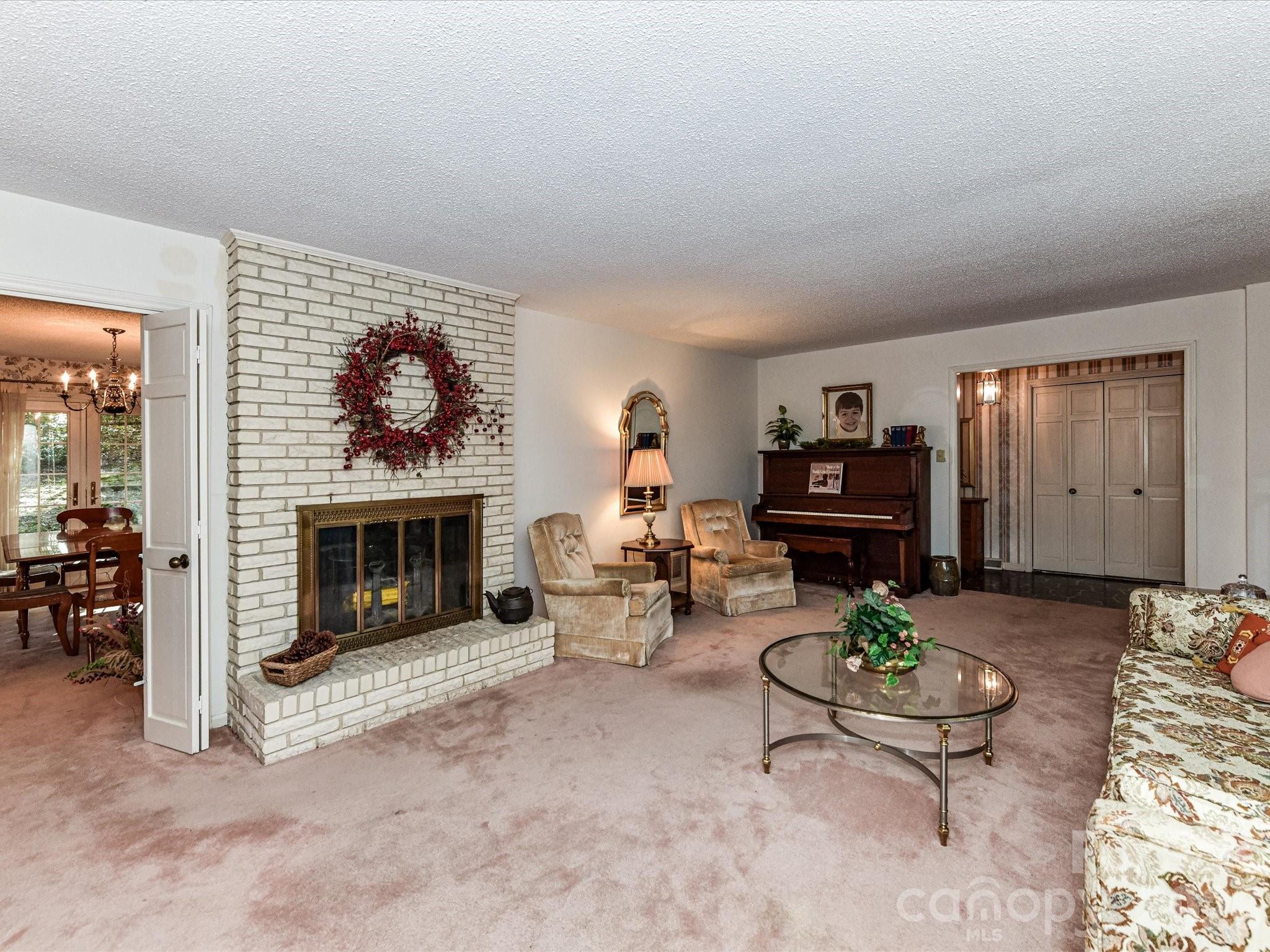 127 Todd Circle Wingate, NC 28174 - Photo 4 of 36 a living room with furniture a fireplace and rug