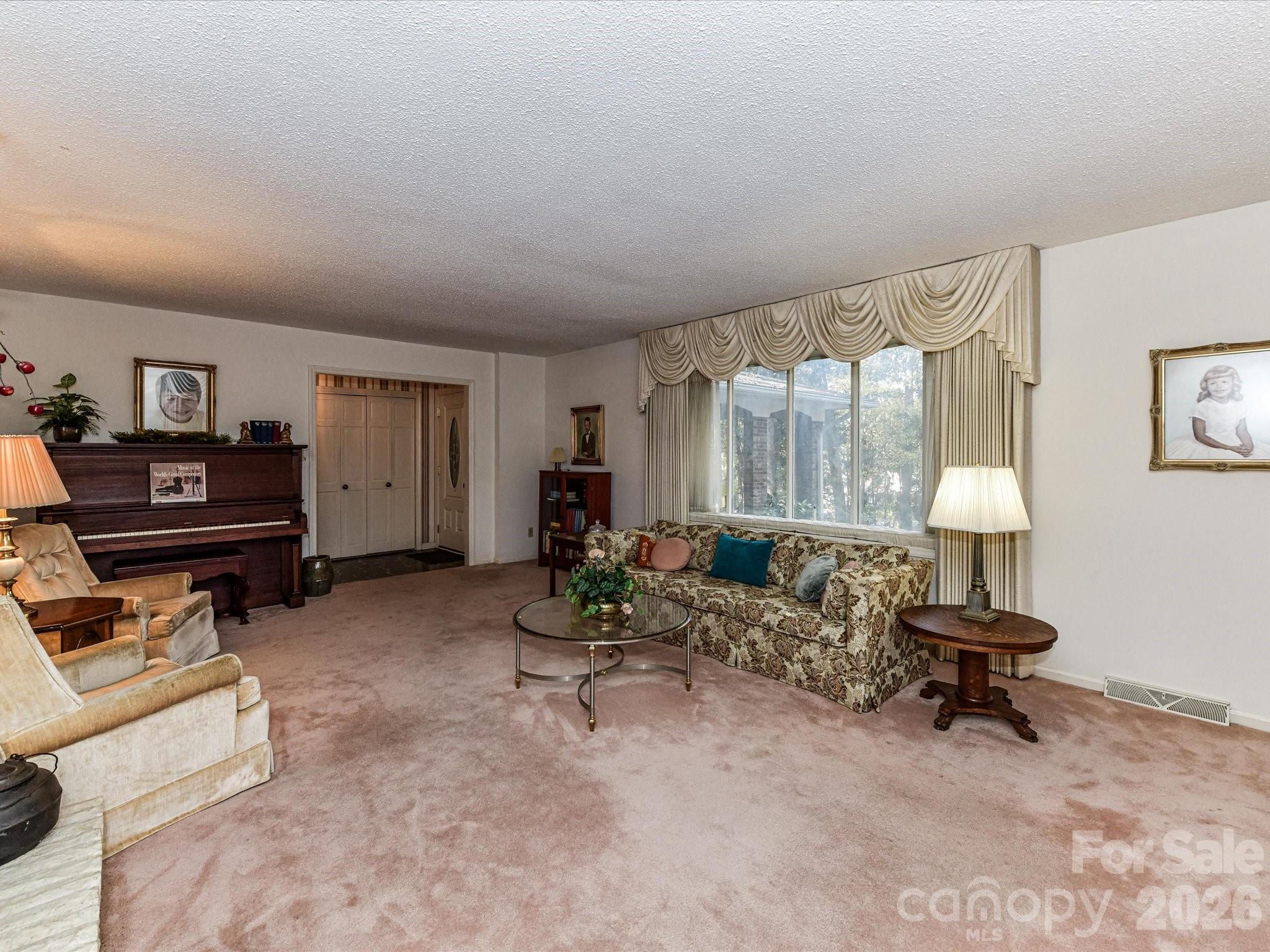 127 Todd Circle Wingate, NC 28174 - Photo 5 of 36 a living room with furniture and a flat screen tv