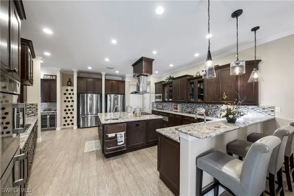 a large kitchen with kitchen island a large island in the center