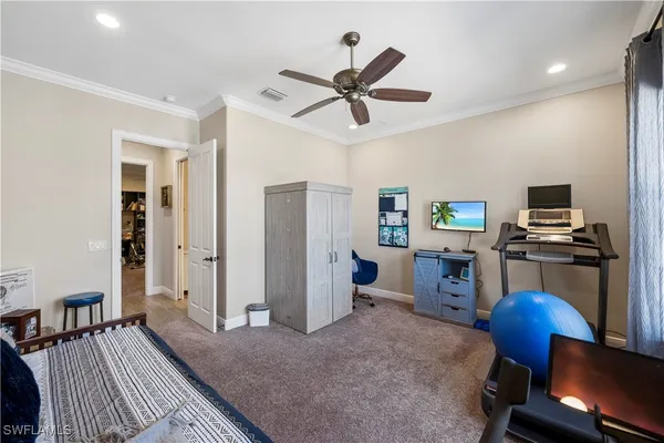 a bedroom with furniture and a window