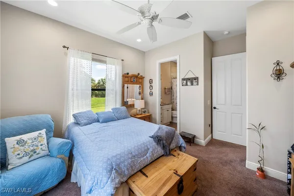 a bedroom with a bed and a couch