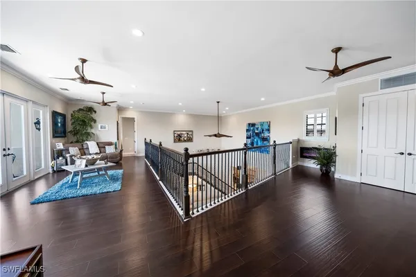 a view of a livingroom with furniture and hardwood floor