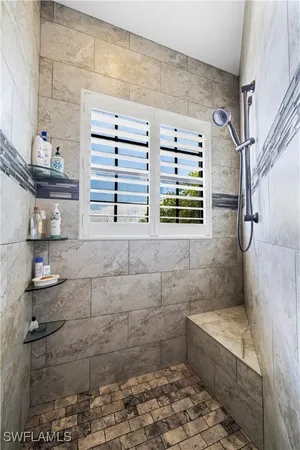a bathroom with a bathtub and shower