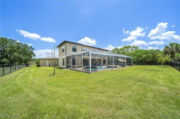 a view of a house with a big yard