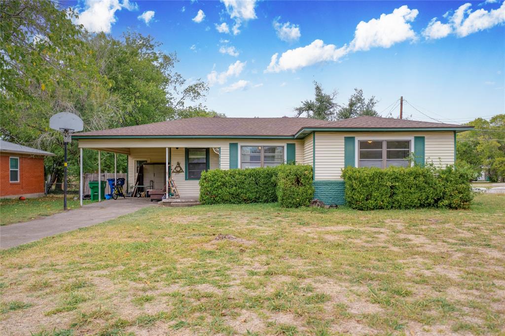 a view of a house with backyard porch and sitting area