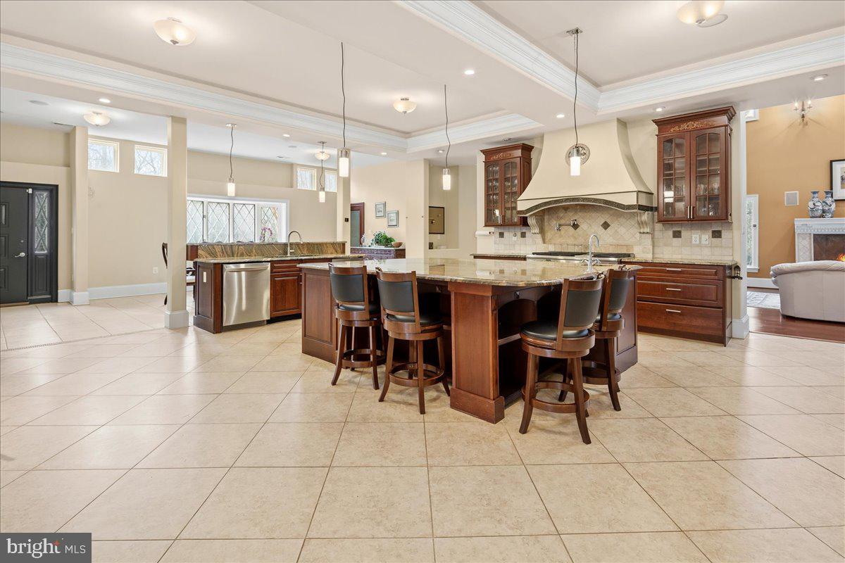 11846 Chapel Road Clifton, VA 20124 - Photo 36 of 143 a kitchen with stainless steel appliances kitchen island granite countertop a sink a counter top space and appliances