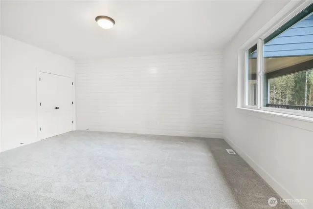 a spacious bathroom with a double vanity sink double mirror and shower