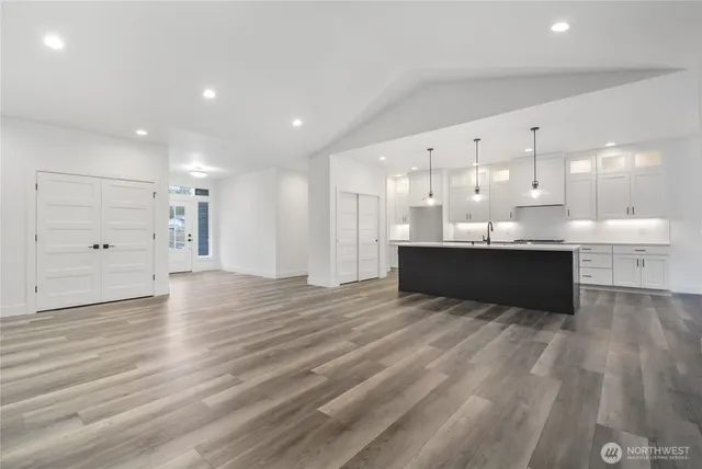 a view of kitchen and kitchen with stainless steel appliances