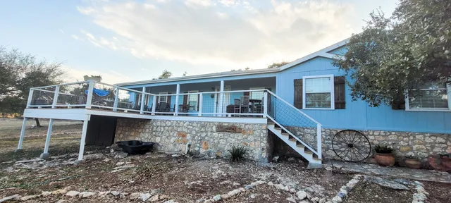 a house view with a backyard space