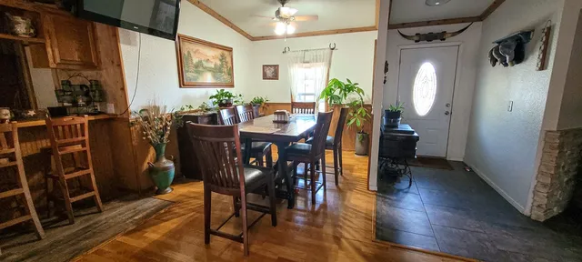 a backyard of a house with table and chairs