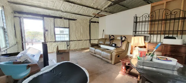 a view of a chairs and table in the roof yard