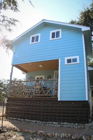 a bedroom with bed and wooden furniture