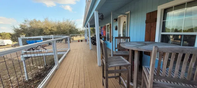 a view of a yard with trees in the background
