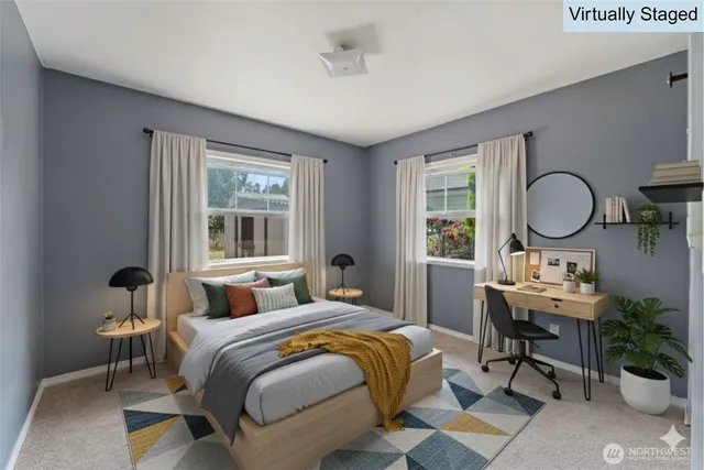 a bedroom with a bed a mirror and a window