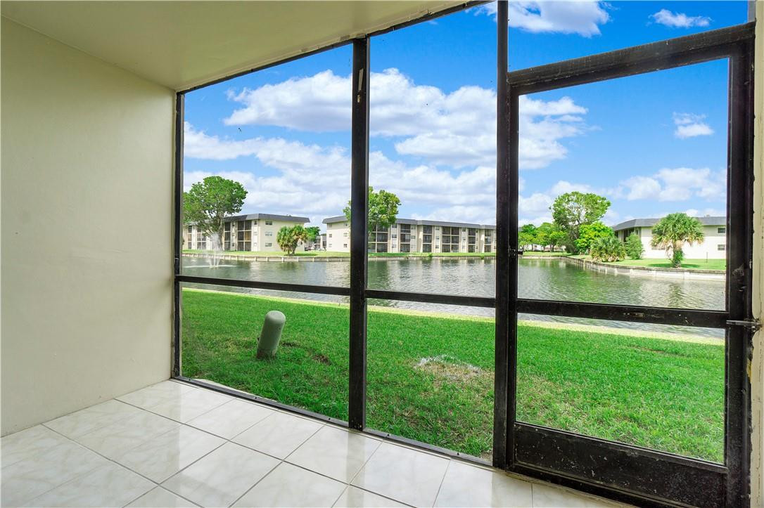 8025 South Colony Circle, Unit 106 Tamarac, FL 33321 - Photo 11 of 14 a view of a back yard from a window