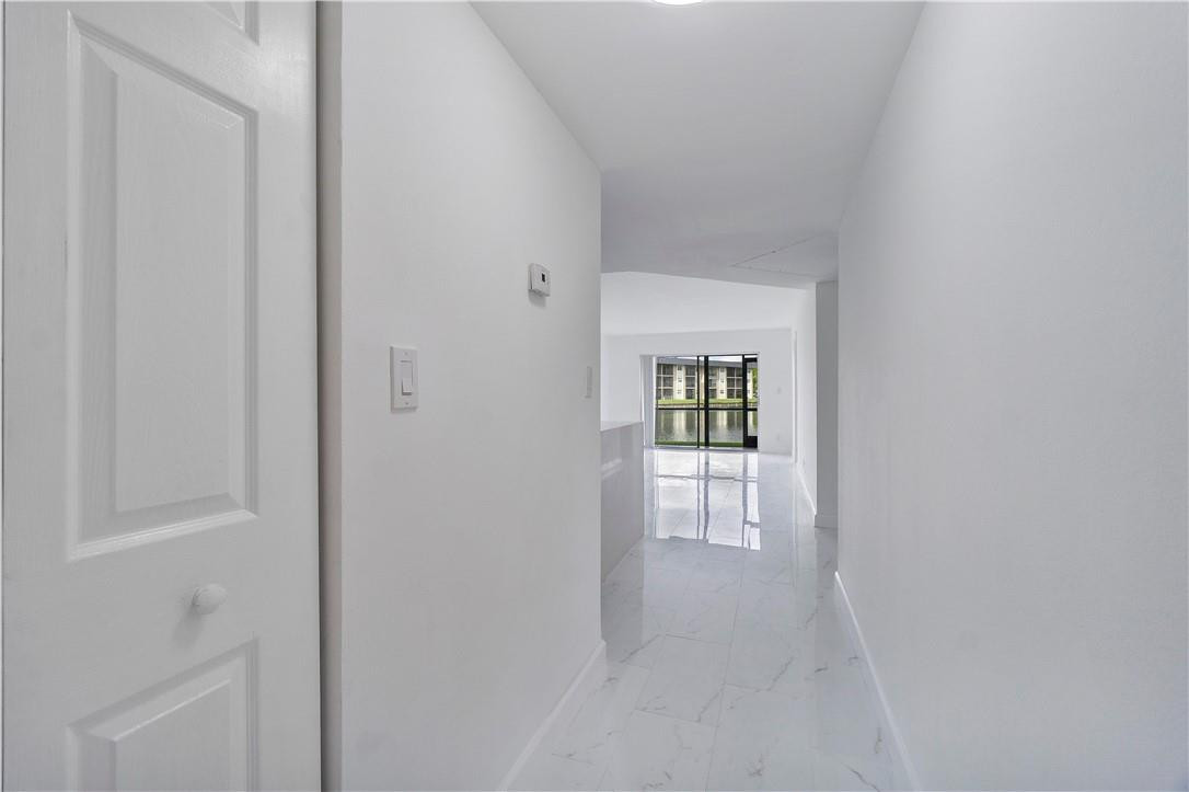 8025 South Colony Circle, Unit 106 Tamarac, FL 33321 - Photo 2 of 14 a view of an empty room with closet and a window