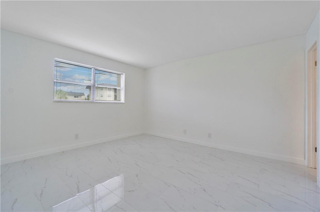 8025 South Colony Circle, Unit 106 Tamarac, FL 33321 - Photo 8 of 14 an empty room with a window