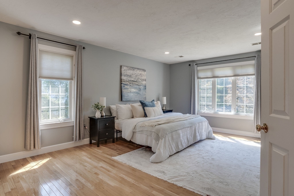 35 Buehler Road Bedford, MA 01730 - Photo 17 of 41 a spacious bedroom with a large bed and a window