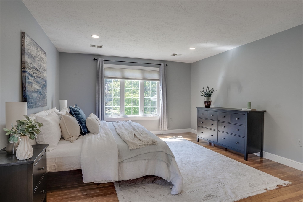 35 Buehler Road Bedford, MA 01730 - Photo 18 of 41 a bedroom with a bed and a dresser