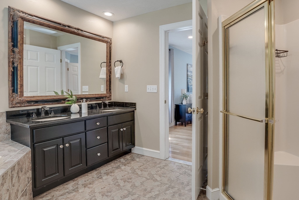 35 Buehler Road Bedford, MA 01730 - Photo 19 of 41 a bathroom with a granite countertop sink and a mirror