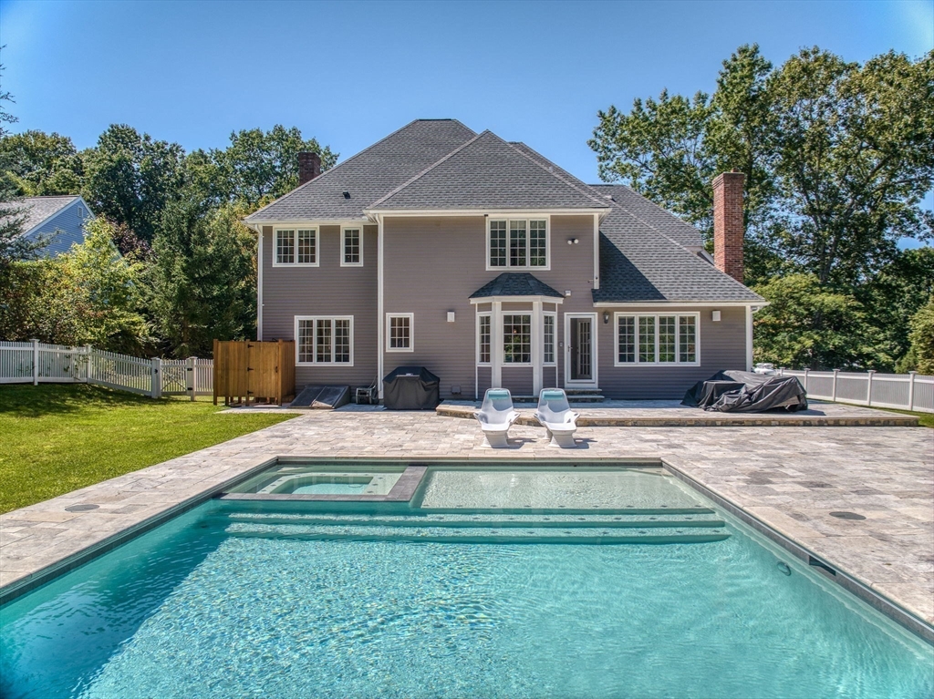 35 Buehler Road Bedford, MA 01730 - Photo 37 of 41 a front view of a house with a yard table and chairs