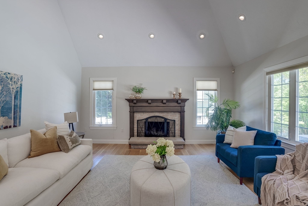 35 Buehler Road Bedford, MA 01730 - Photo 8 of 41 a living room with furniture and a fireplace