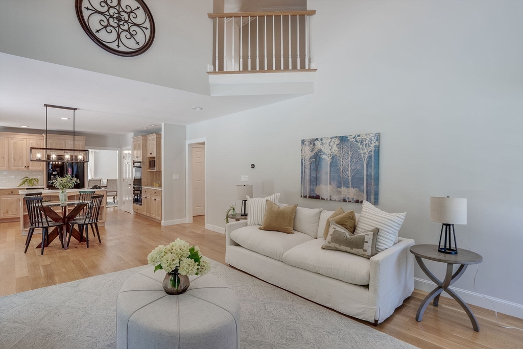 35 Buehler Road Bedford, MA 01730 - Photo 9 of 41 a living room with furniture a clock and a window