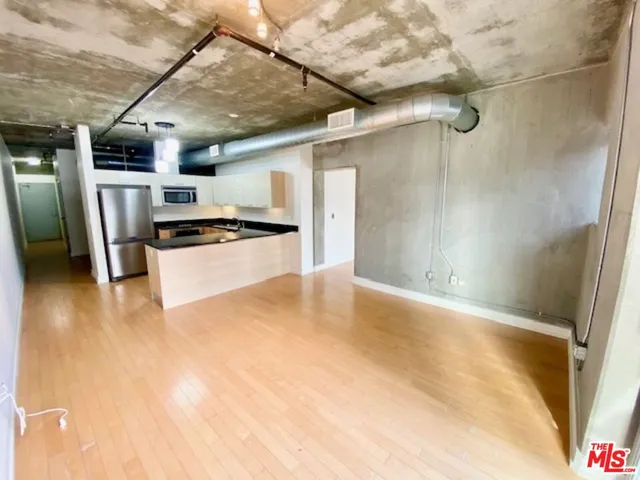 a view of a electric appliances in kitchen and empty room