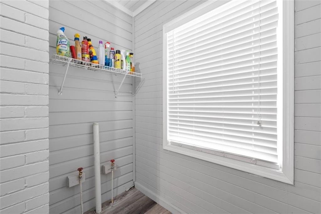 111 Poplar Street Fairburn, GA 30213 - Photo 25 of 32 a bathroom with a door and a window
