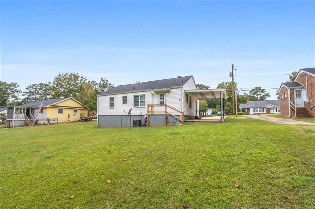 111 Poplar Street Fairburn, GA 30213 - Photo 28 of 32 a house view with a garden space