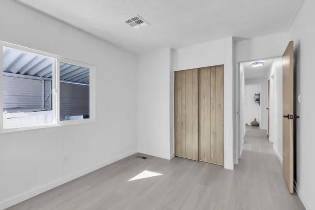 a view of a living room and entry way