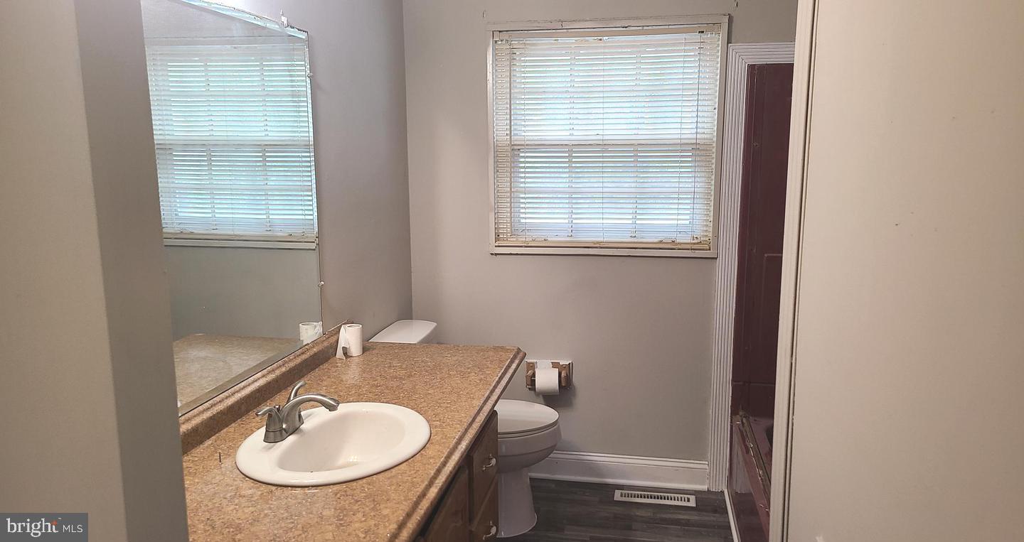 26 Alwyn Road Newark, DE 19713 - Photo 12 of 24 a bathroom with a sink and a mirror