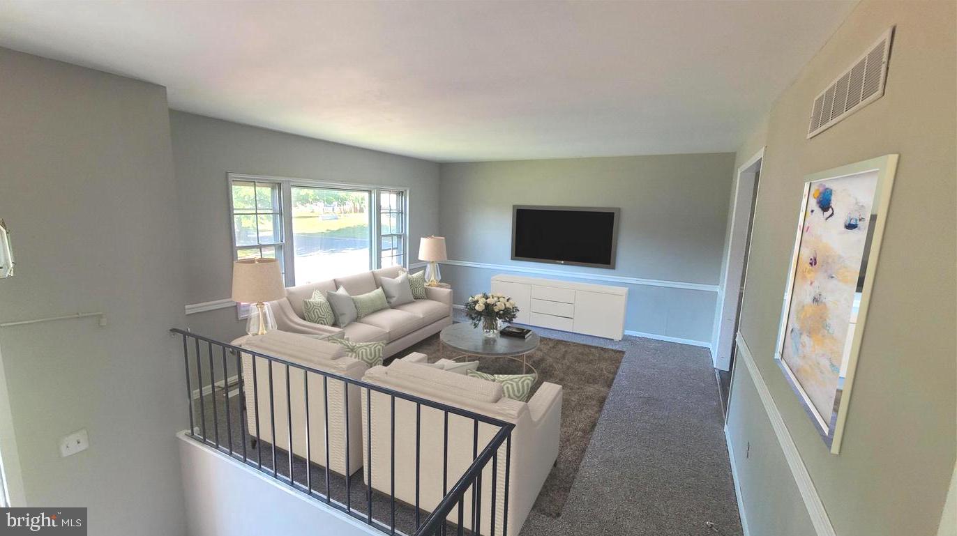 26 Alwyn Road Newark, DE 19713 - Photo 7 of 24 a living room with furniture and a flat screen tv