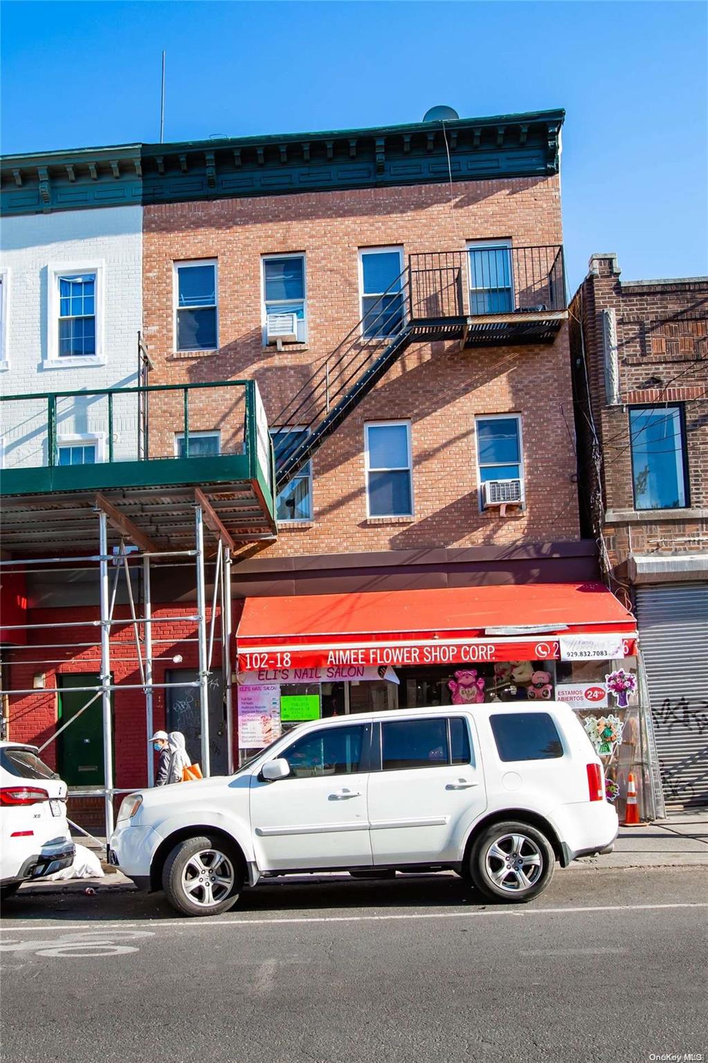 102-18 37th Avenue Queens, NY 11368 - Photo 1 of 12 a car parked in front of a building