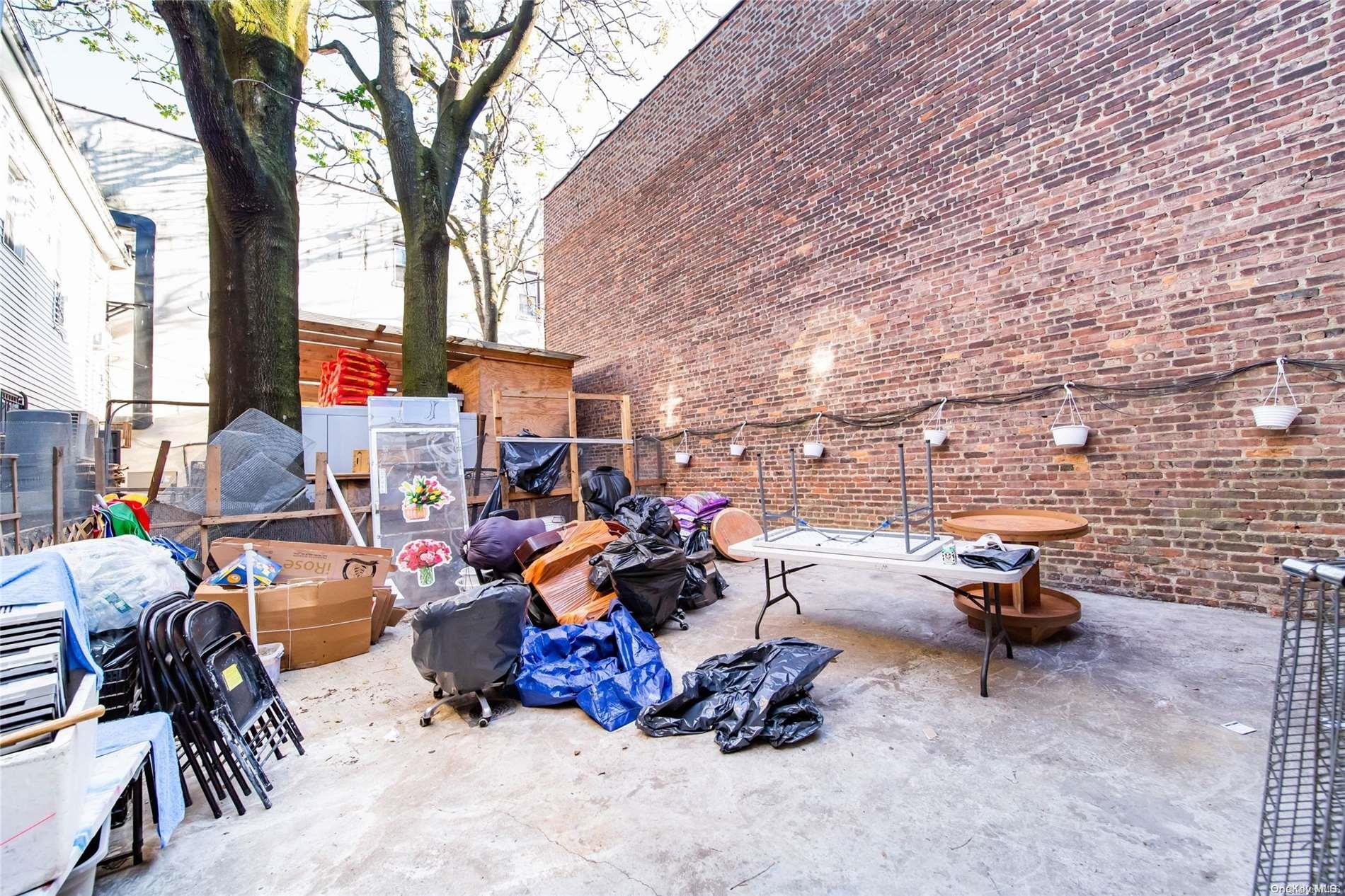 102-18 37th Avenue Queens, NY 11368 - Photo 12 of 12 a view of outdoor space with seating area