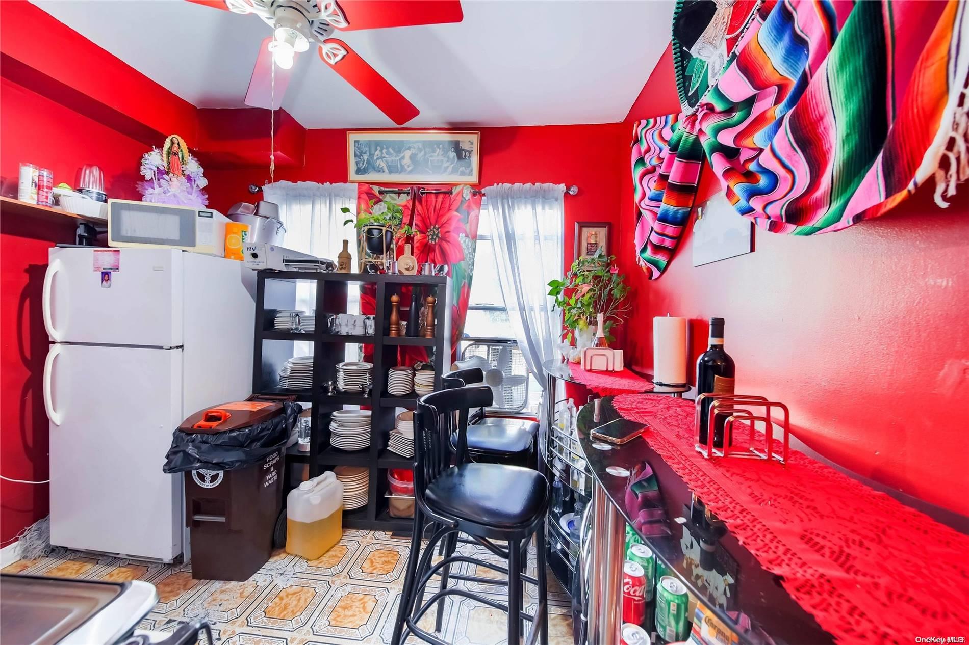 102-18 37th Avenue Queens, NY 11368 - Photo 8 of 12 a store room with lots of different colored cloths