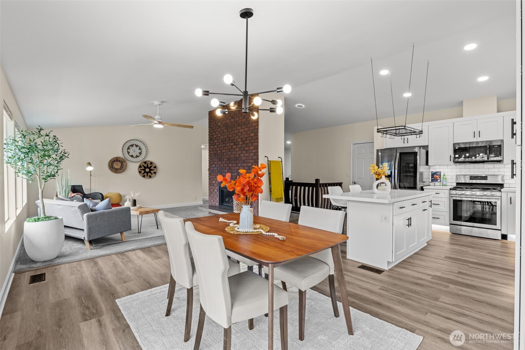 4115 105th Place Southeast Everett, WA 98208 - Photo 12 of 39 a view of a dining room with furniture and wooden floor
