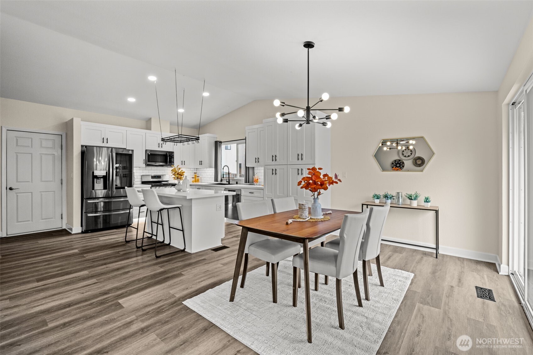 4115 105th Place Southeast Everett, WA 98208 - Photo 13 of 39 a view of a dining room with furniture and wooden floor