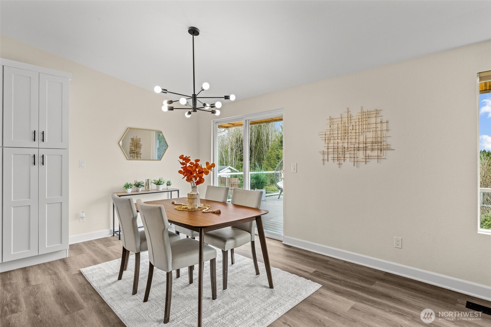 4115 105th Place Southeast Everett, WA 98208 - Photo 14 of 39 a dining room with furniture a chandelier and wooden floor