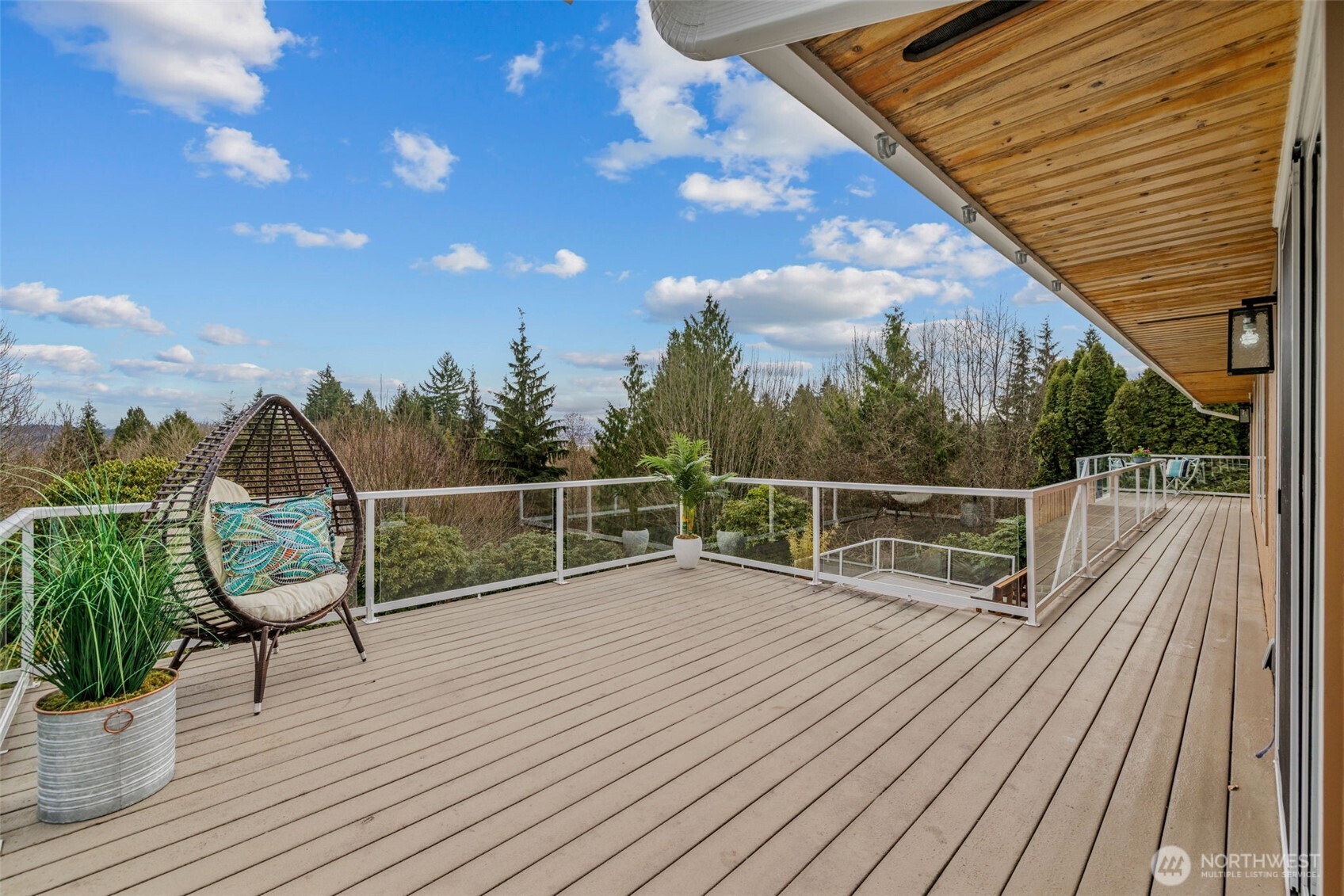 4115 105th Place Southeast Everett, WA 98208 - Photo 19 of 39 a view of a balcony with wooden floor next to a yard