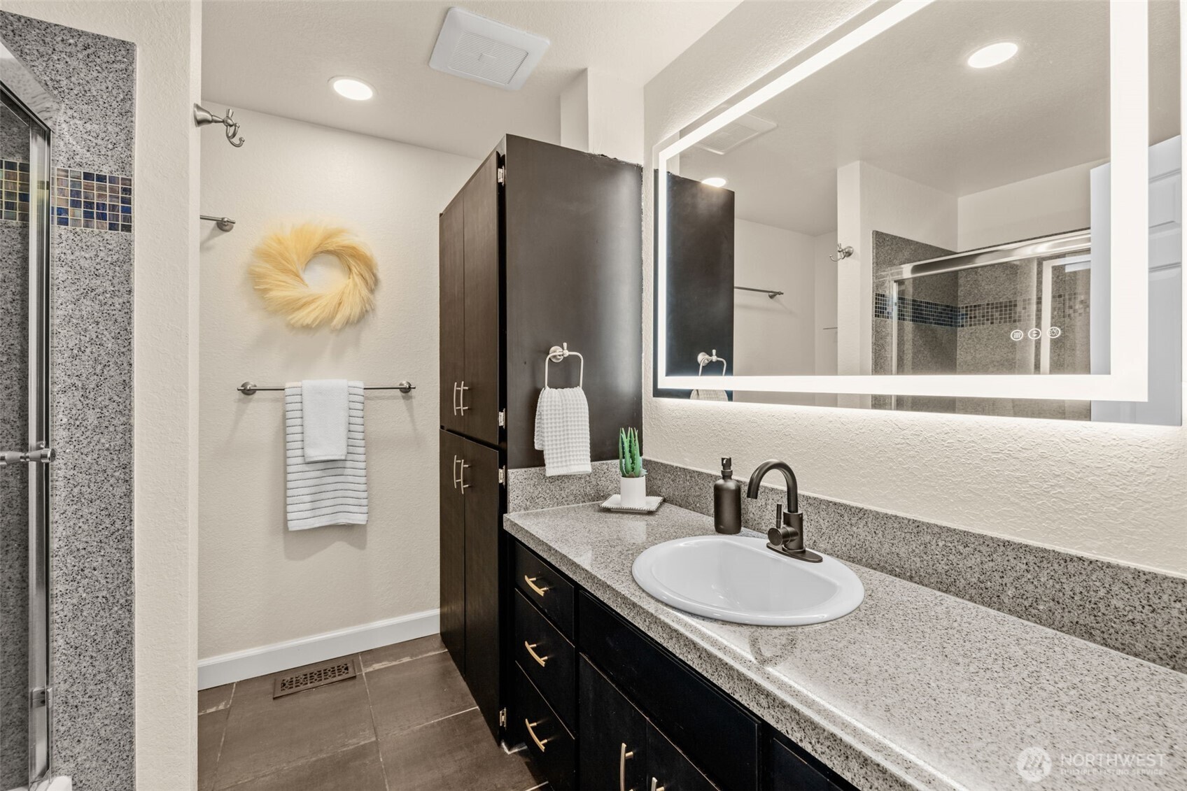 4115 105th Place Southeast Everett, WA 98208 - Photo 22 of 39 a bathroom with a granite countertop sink a mirror and a shower