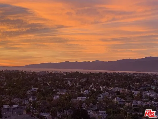 an aerial view of residential house and green space